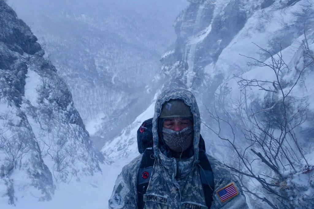 马特里 stands in the harsh snow at Mountain Warfare School