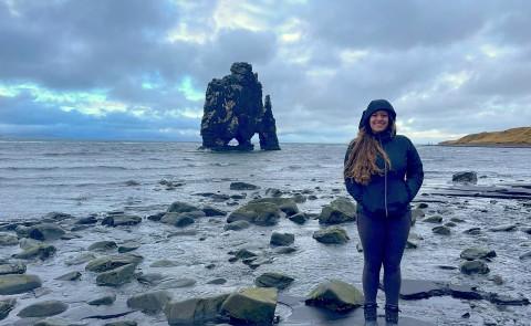 Ariana Telzerow stands in front of the water in Iceland
