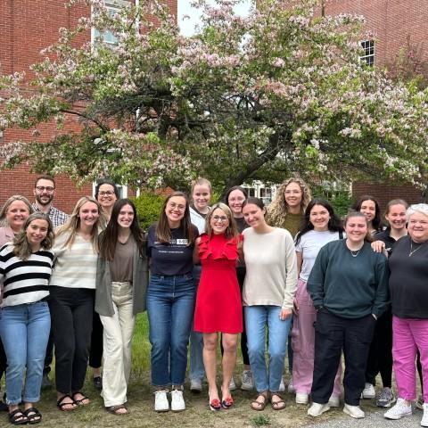 AOTA President Alyson Stover poses with students and faculty from UNE’s Department of Occupational Therapy